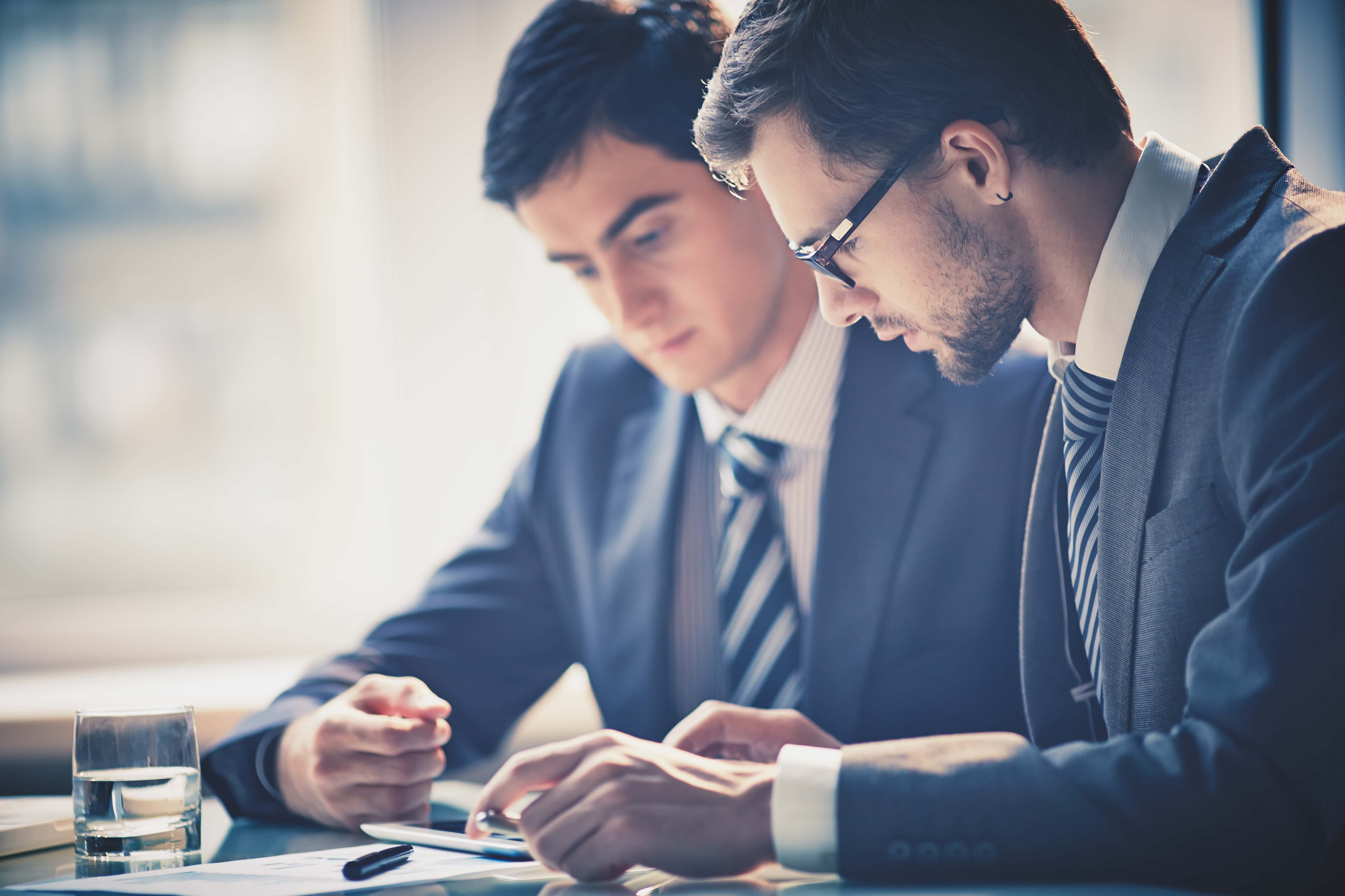 Image of employee giving feedback to another employee in the workplace